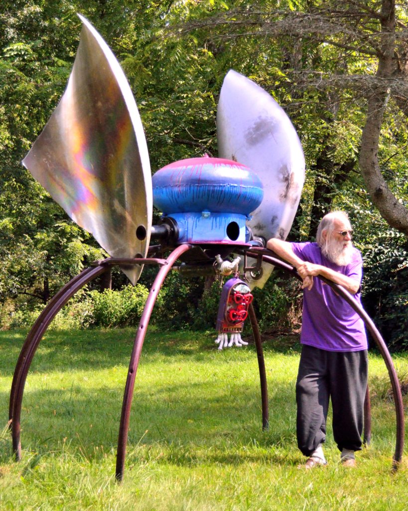 PR Miller Posing with Bug Sculpture